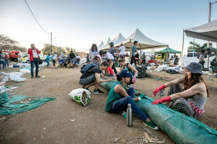 Volunteers rushed to make hand-made oil barriers at Mahebourg waterfront