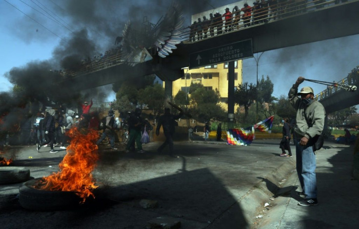 Supporters of Bolivia's exiled ex-president Evo Morales blocking a road in protest at the latest delay to the general election originally due in May, 2020