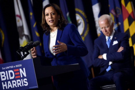 Democratic presidential hopeful Joe Biden listens as his VP pick Kamala Harris rolled out their campaign in Delaware, saying everything is 'on the line'