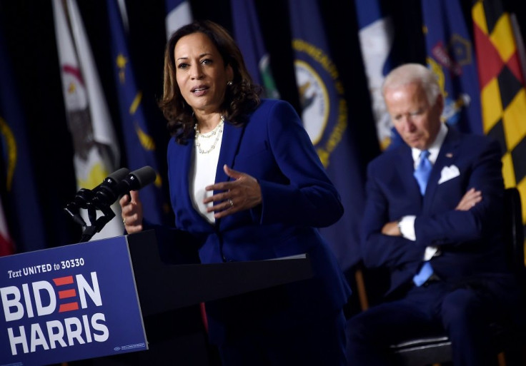 Democratic presidential hopeful Joe Biden listens as his VP pick Kamala Harris rolled out their campaign in Delaware, saying everything is 'on the line'