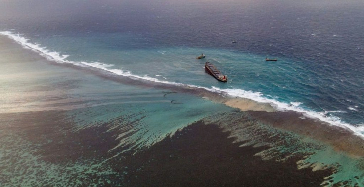 Aerial images showed huge stretches of crystal-clear seas around the marooned cargo ship stained an inky black