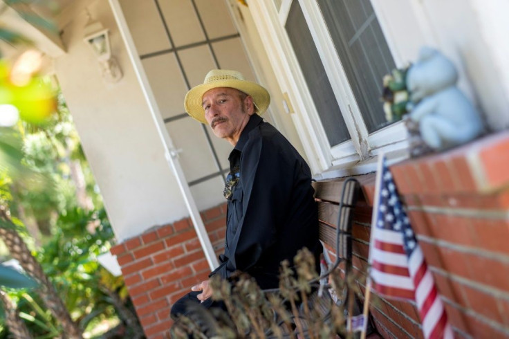 Joaquin Gutierrez poses in front of the house where he is renting a room in Van Nuys, California -- he says he may have to eventually return to his native El Salvador as the money has run out