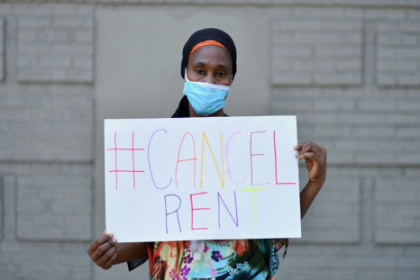 Mariatou Diallo, who has been unable to make her rent payment since March 2020, holds up a sign during a protest against evictions -- the US could soon be facing a major housing crisis sparked by pandemic-related joblessness
