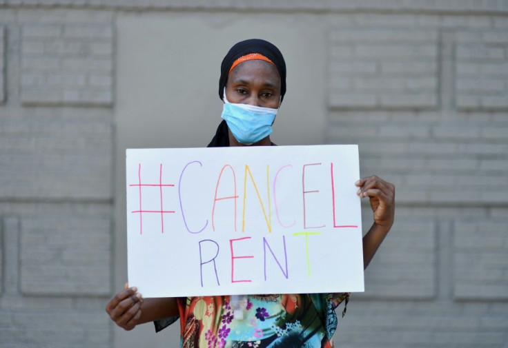 Mariatou Diallo, who has been unable to make her rent payment since March 2020, holds up a sign during a protest against evictions -- the US could soon be facing a major housing crisis sparked by pandemic-related joblessness