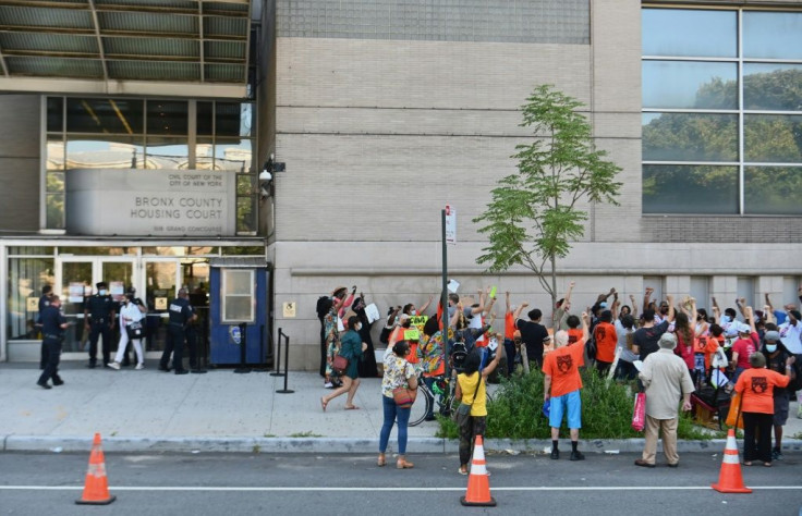 Community members protest against evictions and in support of the "Cancel Rent" movement outside the housing court in the Bronx in New York