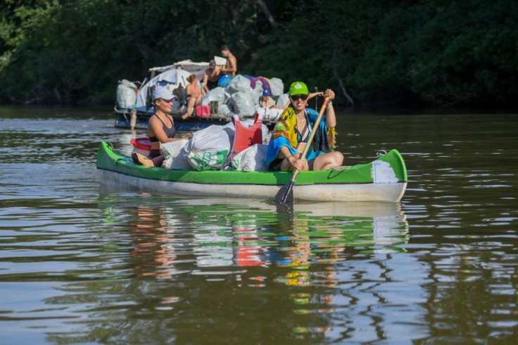 Rafters race down the Tisza River in northeastern Hungary collecting as much rubbish as possible