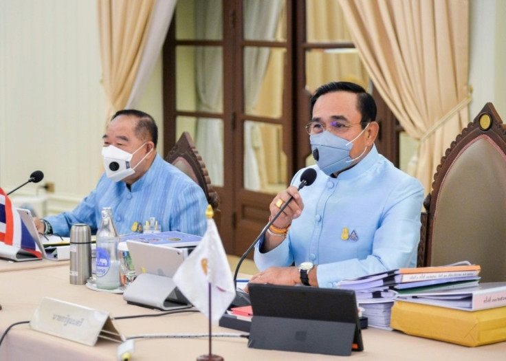 Thai Prime Minister Prayut Chan-O-Cha (R) attends a cabinet meeting Thursday