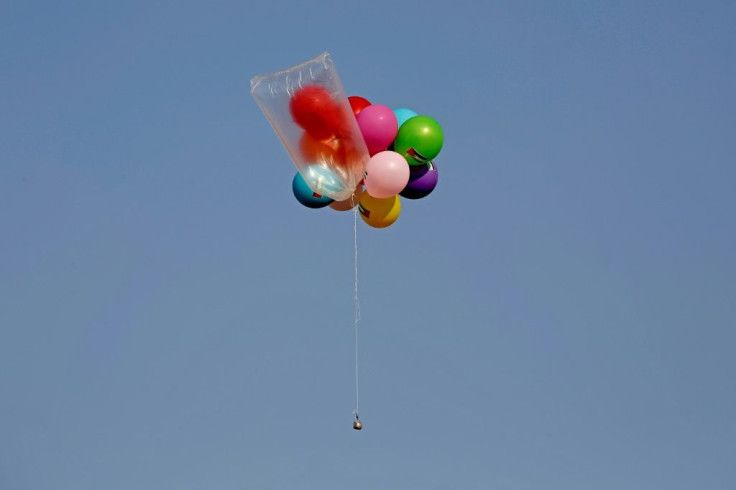 Balloons carrying an incendiary device were released by Palestinians near Gaza's Bureij refugee camp, located at the Israel-Gaza border fence, on August 12