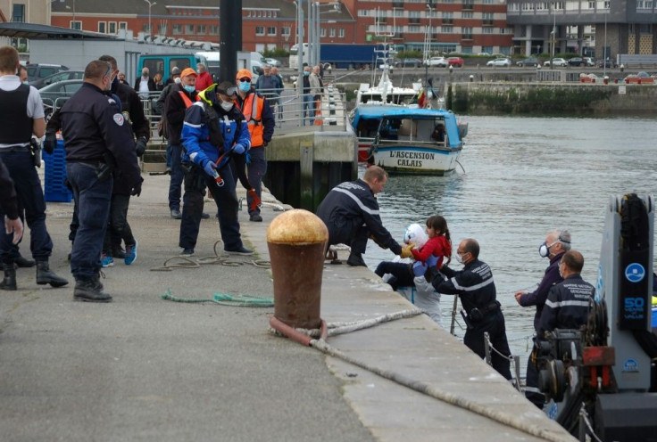 Britain's Conservative Party government has looked to increase pressure on France to prevent migrants coming into UK waters, such as these migrants being assisted by French gendarmes and police in Calais in May 2020 after a failed crossing attempt