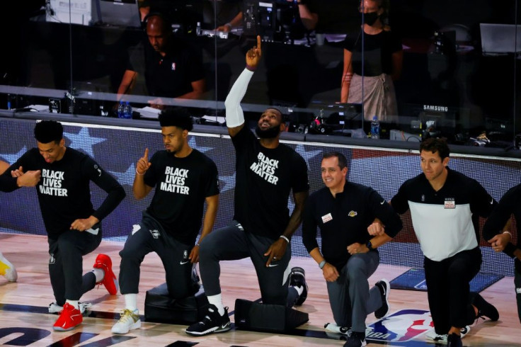 Los Angeles star LeBron James points to the sky following the national anthem before the start of the Lakers' final regular-season NBA game against the Sacramento Kings