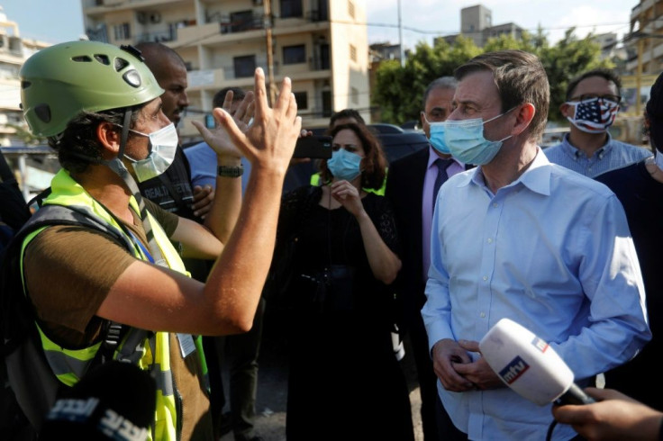 The top US career diplomat David Hale talks with young volunteers in a hard-hit neighbourhood of Beirut, bypassing the politicians many Lebanese blame for the disaster