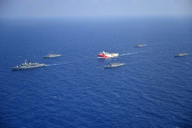 The Turkish Oruc Reis research ship, accompanied by a small navy fleet, sails into disputed Mediterranean waters