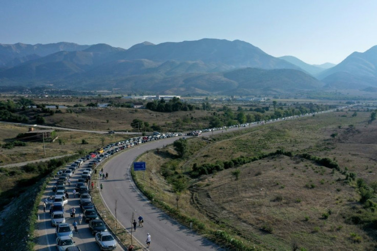 A 20-kilometre-long traffic jam formed at the Kakavia border crossing from Albania into Greece as thousands of Albanians rushed to re-enter  Greece for work ahead of new virus rules