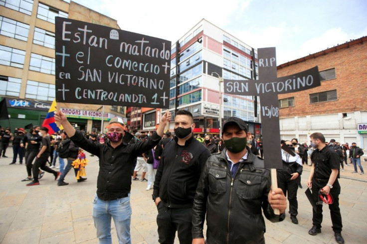 Merchants wearing black clothes and face masks staged anti-lockdown protests in Colombia