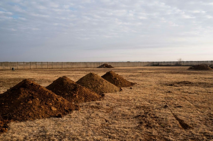 Mounds of soil mark where graves were dug at the Honingnestkrans Cemetery in Pretoria for victims of COVID-19 in July 2020