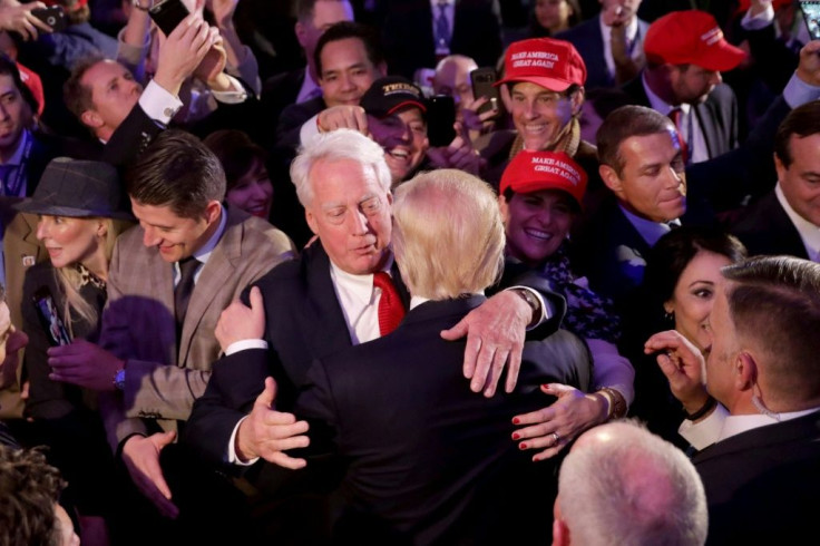 Then president-elect Donald Trump hugs his younger brother in 2016