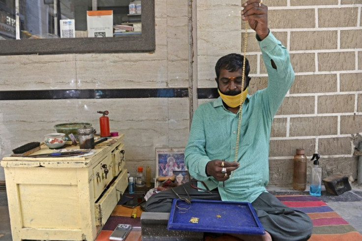 A goldsmith makes jewellery at a workshop in Hyderabad