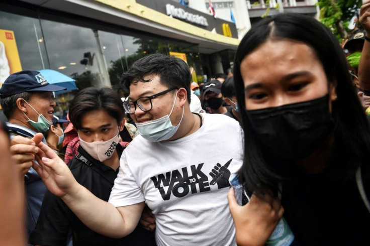 Thai activist Parit 'Penguin' Chirawak also participated in the rally, flanked by cheering supporters