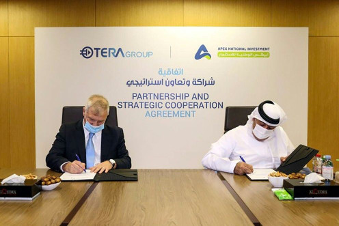 Representatives from the Emirati company APEX National Investment (R) and the Israeli TeraGroup sign an agreement to develop research on the novel coronavirus