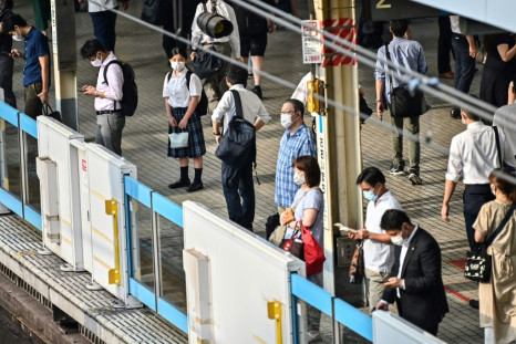Commuters in Tokyo. Japan's economy shrank 7.8 percent in the April-June quarter