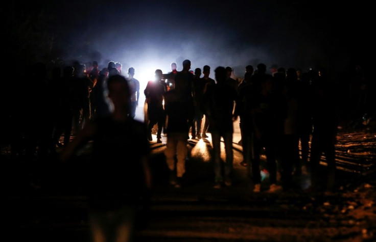 Palestinian protesters from a group calling themselves the "Night Confusion Units" gather near the Gaza-Israel border east of al-Bureij camp for Palestinian refugees in the central Gaza Strip on Sunday