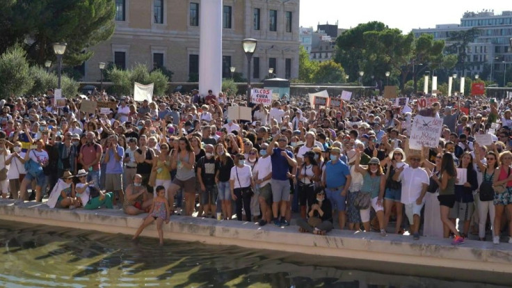 Chanting "freedom", hundreds of people rally in Spain's capital Madrid to protest against the mandatory use of facemasks and other restrictions imposed by the Spanish government to contain the coronavirus pandemic.Duration: 00:56