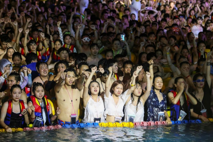 None of the tightly-packed partygoers were seen to be wearing face masks