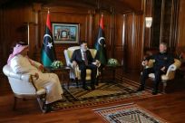 Prime Minister of Libya's UN-recognised Government of National Accord (GNA) Fayez al-Sarraj (C) meets with Turkish Defence Minister Hulusi Akar (R), and his Qatari conterpart Khaled bin Mohammad Al-Attiyah (L) in the capital Tripoli