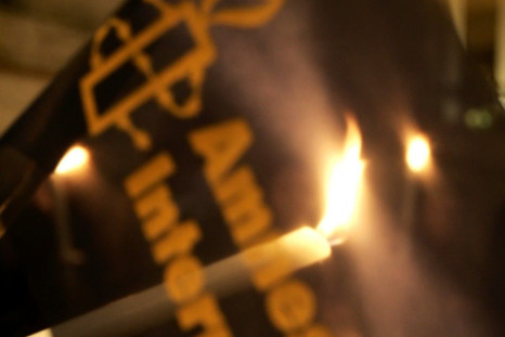 Amnesty International activists hold candles during protest against death penalty in front of US embassy in Rome