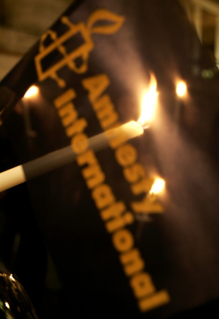 Amnesty International activists hold candles during protest against death penalty in front of US embassy in Rome