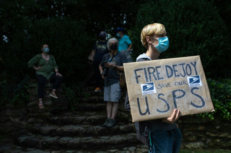 Protesters accuse the Trump administration of attempting to undermine the election by running down the postal service