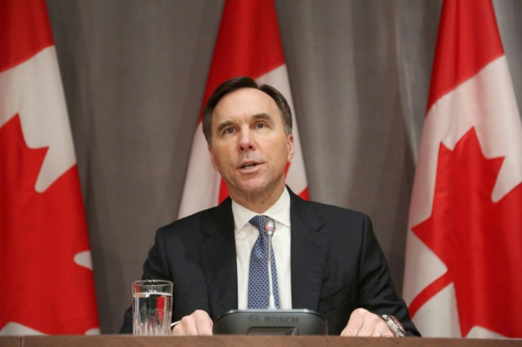 Bill Morneau, seen here in Ottawa in March, resigned as Canada's finance minister late Monday.