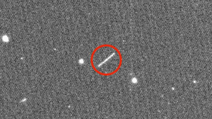 This NASA/JPL/ZTF/Caltech Optical Observatories handout image obtained on August 18, 2020 shows asteroid 2020 QG (the circled streak in the center), which came closer to Earth than any other nonimpacting asteroid on record