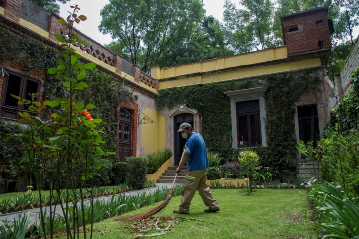 A man works in the garden of the Mexico City house (now a museum) of Marxist revolutionary Leon Trotsky, who landed in Mexico in 1937 after drifting from Turkey to Norway to France