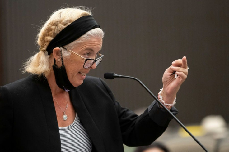 Patti Cosper, the daughter of rape survivor Patricia Murphy shows Joseph James DeAngelo the middle finger after reading a statement on her mother's behalf during the first day of victim impact statements at the Gordon D. Schaber Sacramento County Courthou