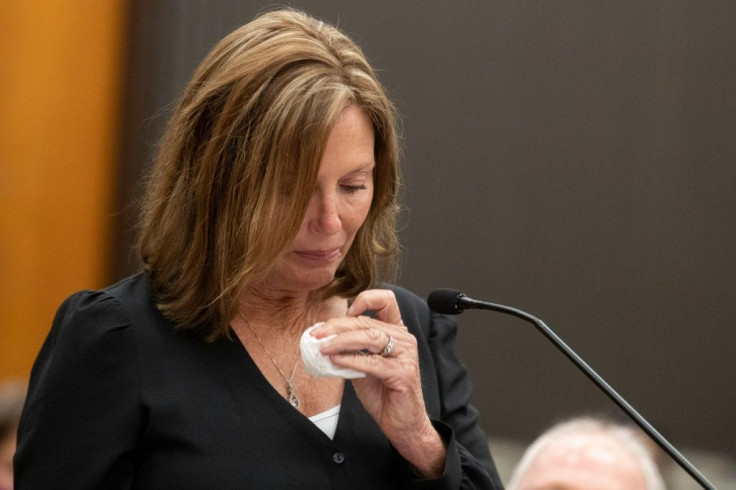 Kris Pedretti reads a statement at the podium as Joseph James DeAngelo is present in the court room during the first day of victim impact statements at the Gordon D. Schaber Sacramento County Courthouse on August 18, 2020, in Sacramento.
