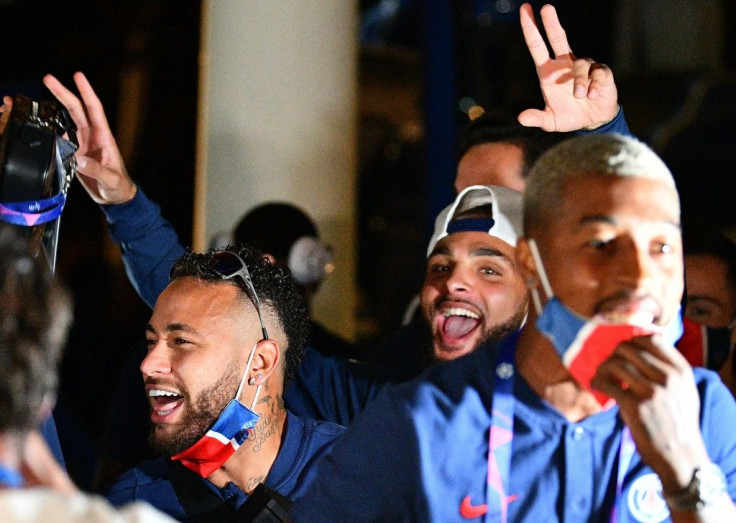 Paris Saint-Germain players, including Neymar, celebrate at the team's hotel in Lisbon after winning through to the Champions League final