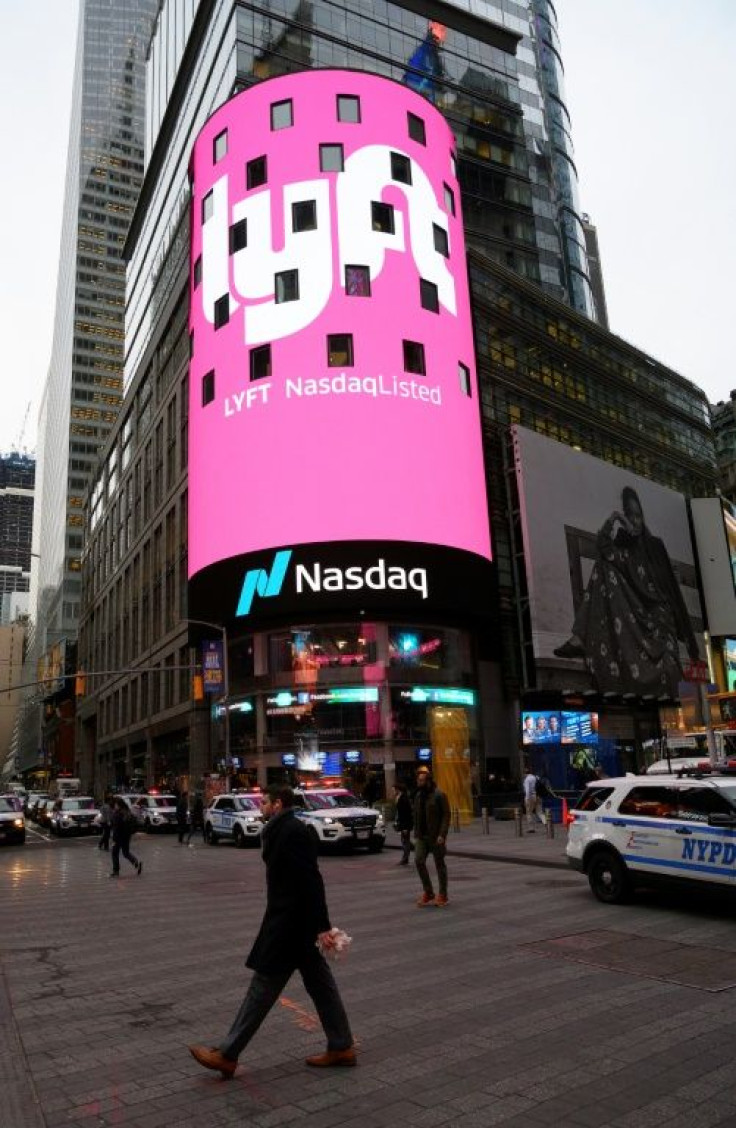 The Lyft logo is shown on the screen at the Nasdaq offices in Times Square in New York City