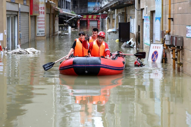 Rescuers evacuate flood-affected residents in Neijiang in Sichuan province
