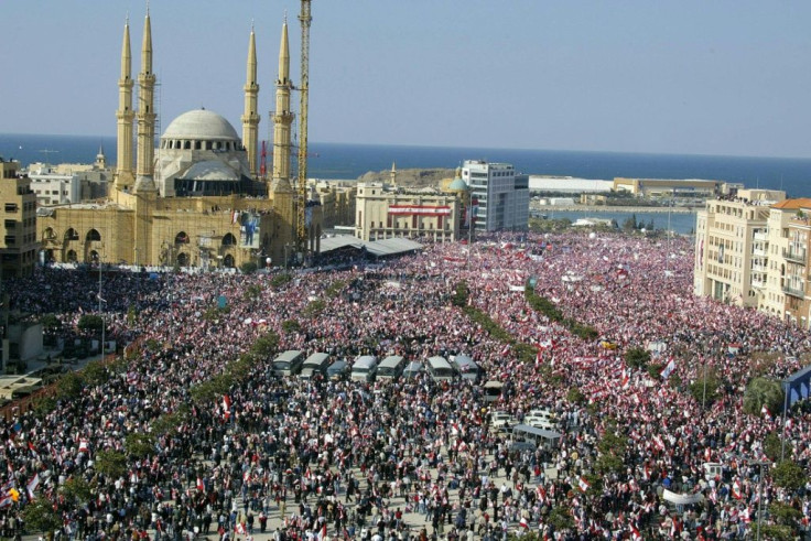 Hunndreds of thousands of Lebanese pack Martyrs Square in downtown Beirut near the grave of former prime minister Rafic Hariri, a month after his February 14, 2005 assassination, demanding the truth behind his murder