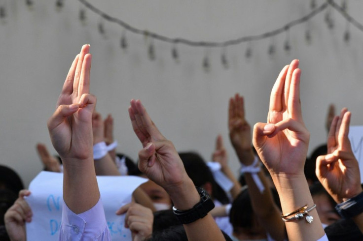 Thai students have adopted a three-fingered salute made popular by the popular "Hunger Games" move as a symbol of their opposition to the government