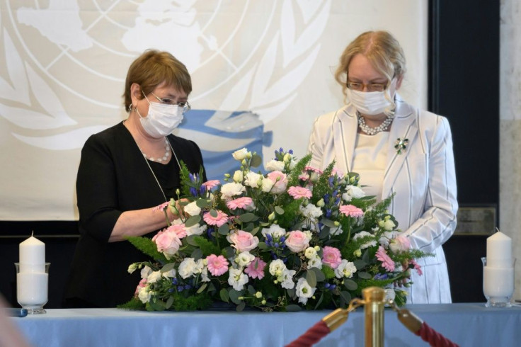 UN human rights chief Michelle Bachelet, left, at a Geneva wreath-laying ceremony marking World Humanitarian Day