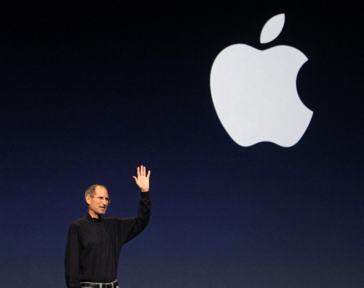 Apple Inc. CEO Steve Jobs gives a wave at the conclusion of the launch of the iPad 2 on stage during an Apple event in San Francisco