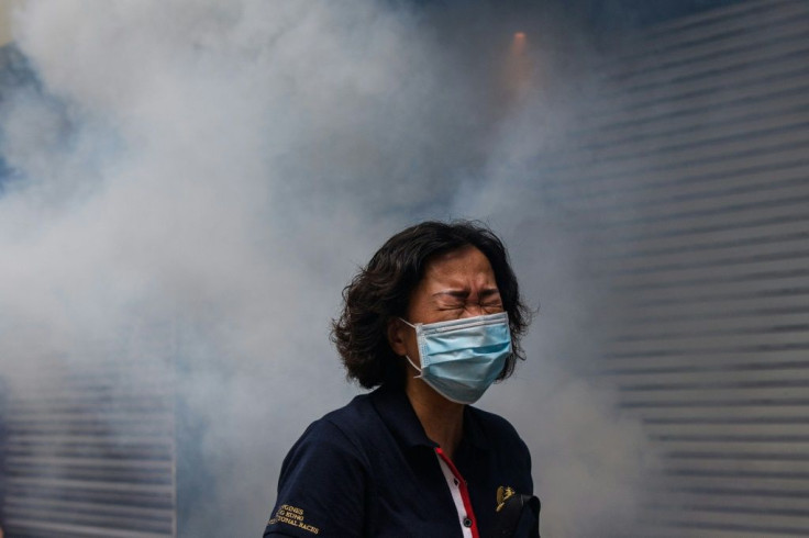A Hong Kong woman shown after riot police fired tear gas to disperse protesters taking part in a pro-democracy rally on May 24