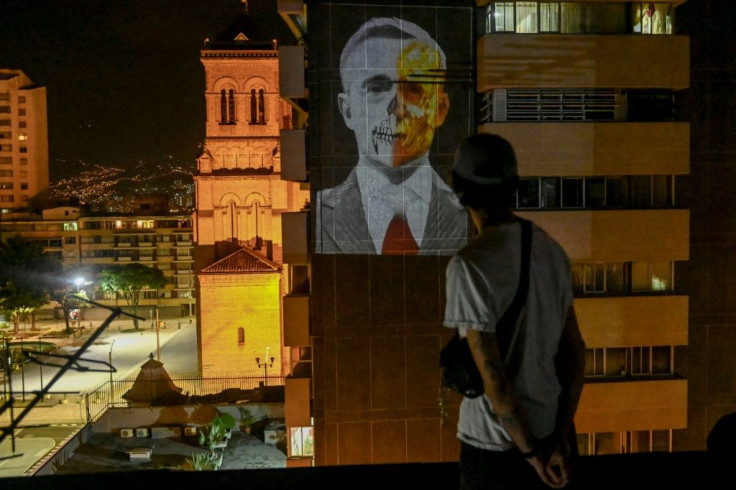 An image depicting former Colombian president Alvaro Uribe is projected in Medellin