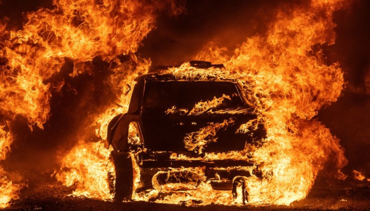 A car burns while parked at a residence in Vacaville, California during the LNU Lightning Complex fire on August 19, 2020