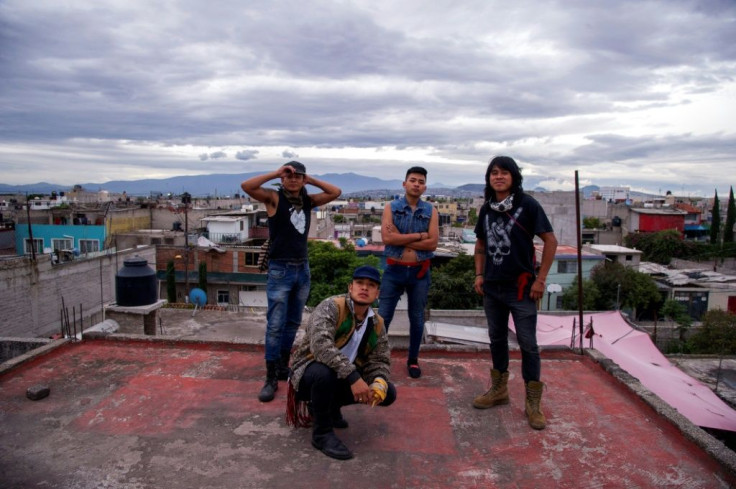Members of Mexican rock band Los Cogelones, the Sandoval brothers (L-R) Beto, Victor, Gabriel and Marco pose for a photograph in Ciudad Nezahualcoyotl on August 12, 2020