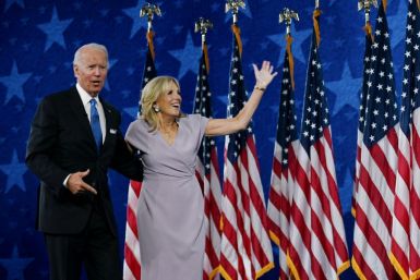 Jill Biden and Democratic presidential nominee Joe Biden stand on stage at the Chase Center in Wilmington, Delaware, at the conclusion of the Democratic National Convention, held virtually amid the novel coronavirus pandemic, on August 20, 2020