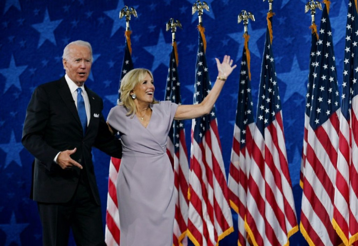 Jill Biden and Democratic presidential nominee Joe Biden stand on stage at the Chase Center in Wilmington, Delaware, at the conclusion of the Democratic National Convention, held virtually amid the novel coronavirus pandemic, on August 20, 2020