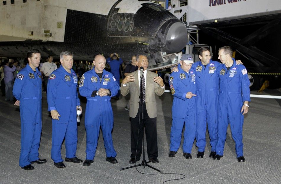 The crew of the Space shuttle Endeavour is joined by NASA Administrator Charles Bolden in Cape Canaveral